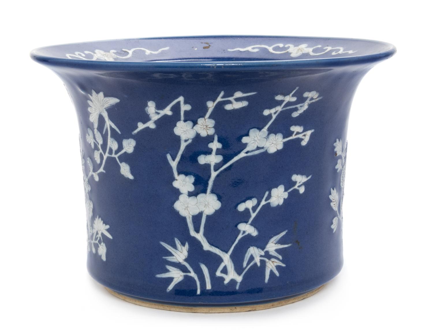 A Chinese White Slip Decorated Blue Glazed Porcelain Cache Pot Diameter 10 1/2 inches.