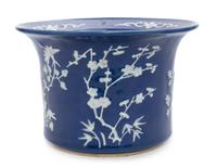 A Chinese White Slip Decorated Blue Glazed Porcelain Cache Pot Diameter 10 1/2 inches.