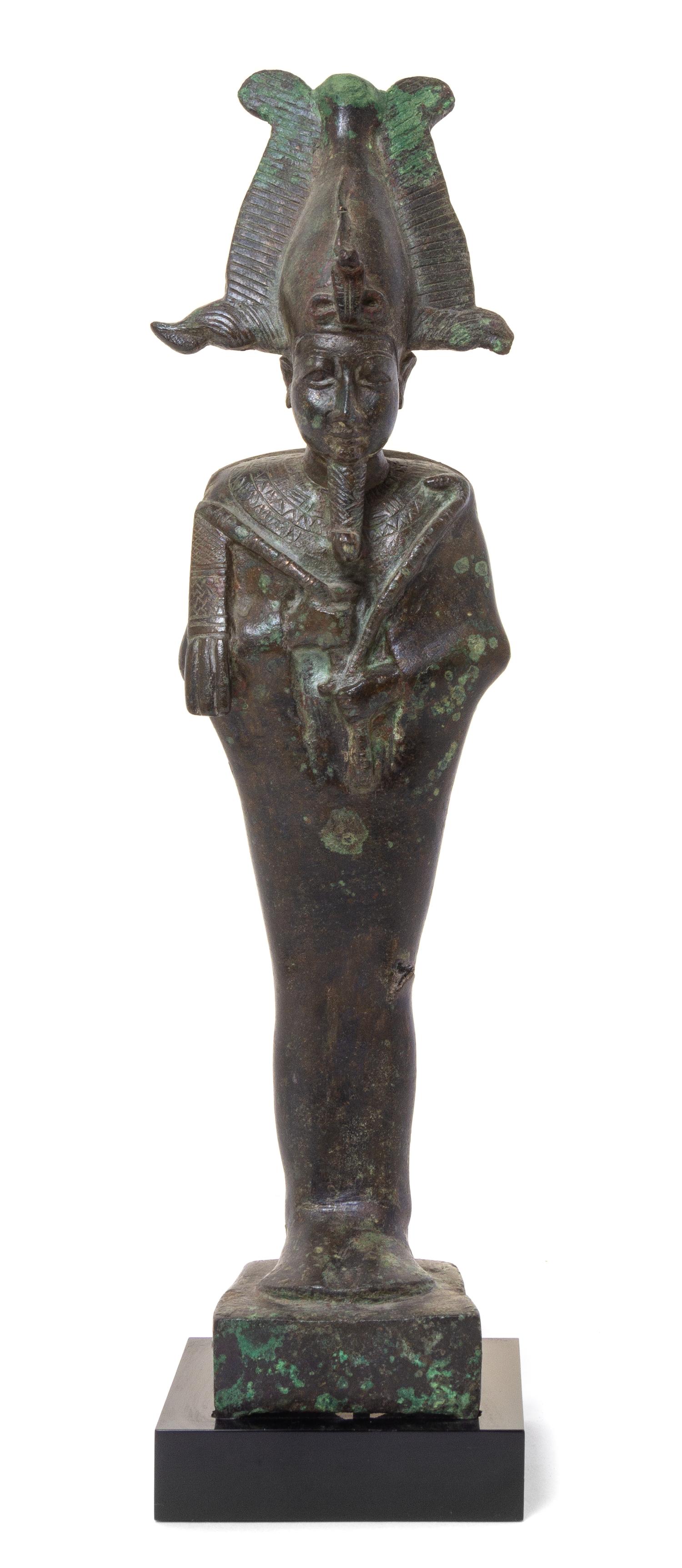An Egyptian Bronze Standing Osiris Height 11 inches. — LATE PERIOD, DYNASTY 26-30, 664-343 B.C.E.