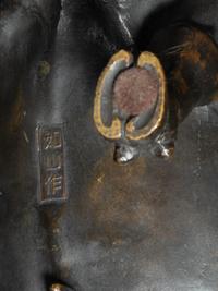 A Japanese Bronze Okimono of Two Tigers and A Bull