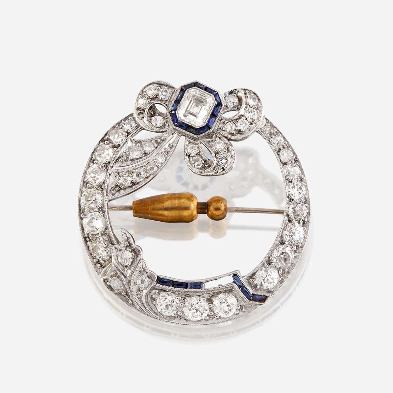 A diamond, sapphire, and platinum brooch
