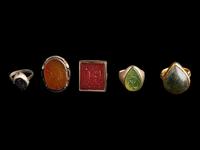 A Group of Five Islamic Stone and Metal Finger Rings