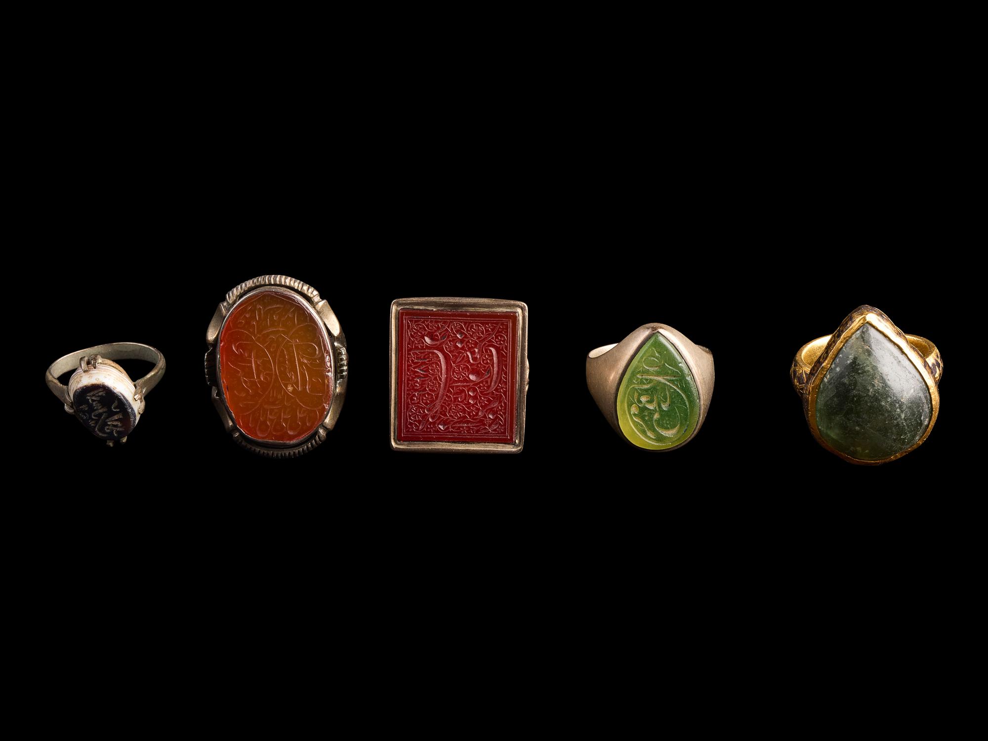 A Group of Five Islamic Stone and Metal Finger Rings