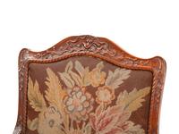 A Pair of Régence Style Walnut Fauteuils