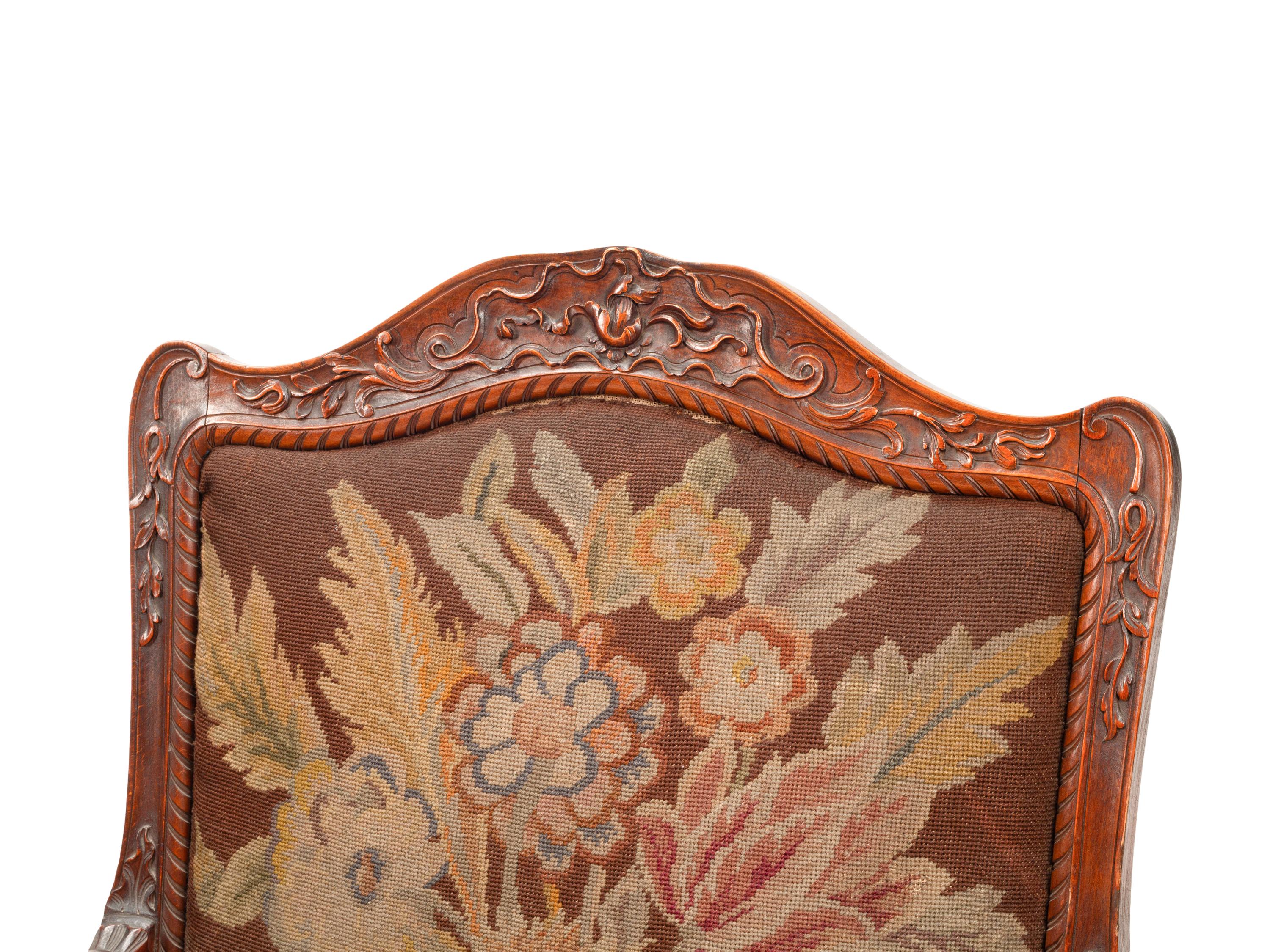 A Pair of Régence Style Walnut Fauteuils