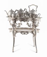 A Rare German Silver Two-Tier Tea Table with Matching Five-Piece Tea Service and Two Trays