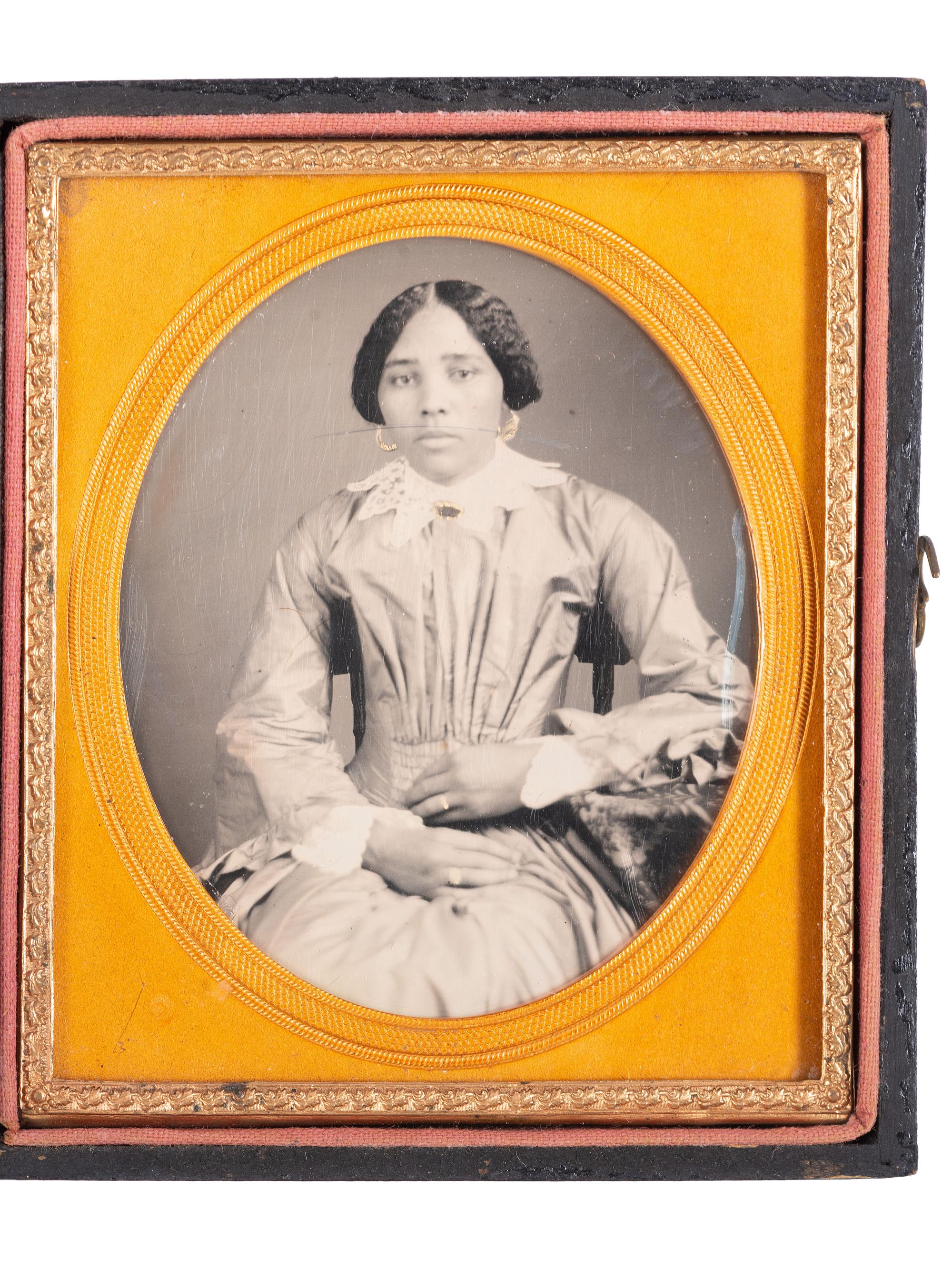[EARLY PHOTOGRAPHY]. Sixth plate daguerreotype portrait of a lovely African American woman.