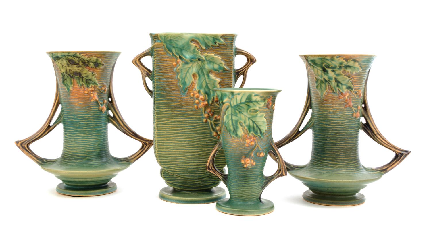 Two Pairs of Roseville Bushberry Pottery Vases Height of first pair 8 1/4 inches, second 6 1/4 inches.