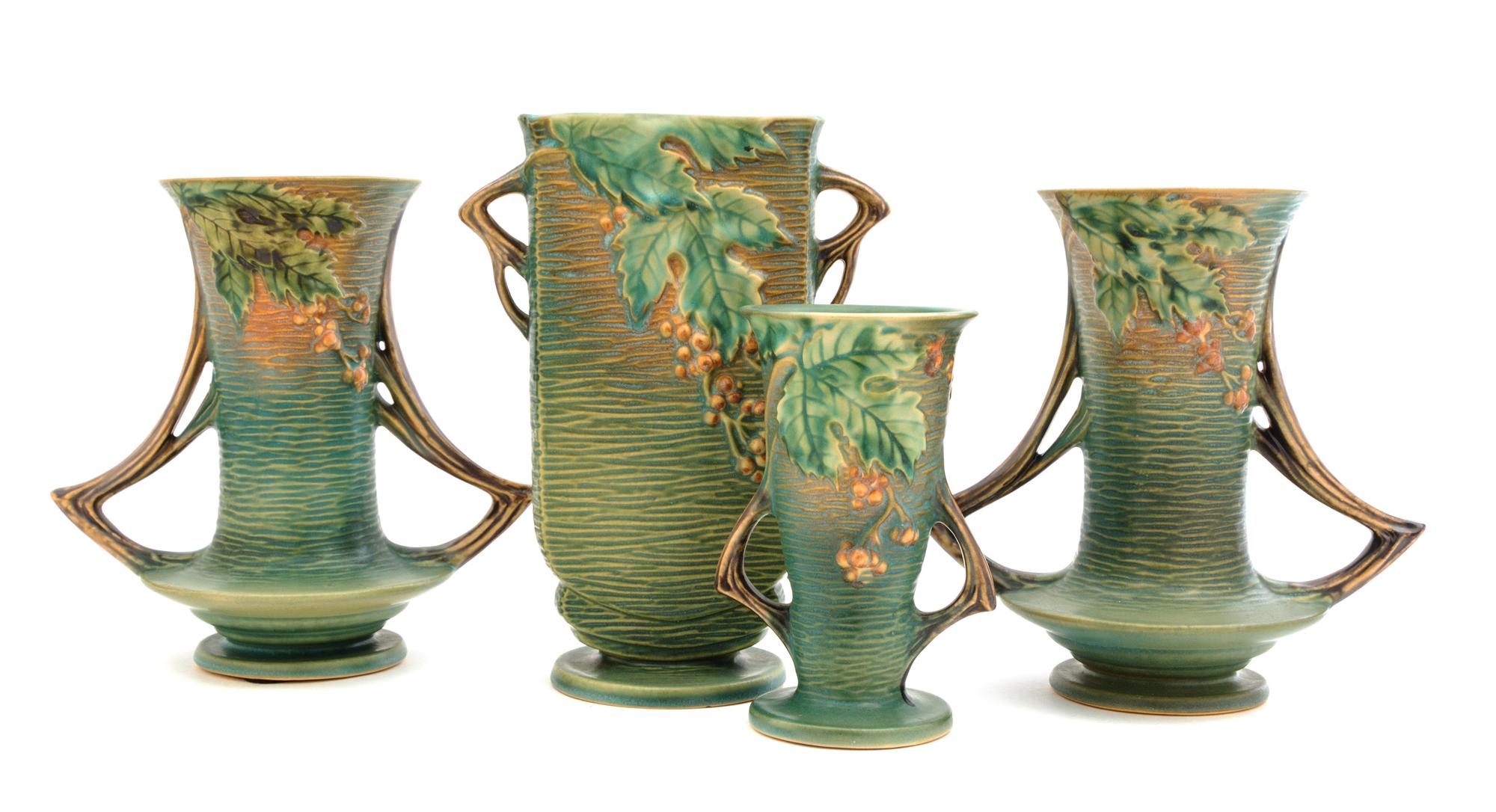 Two Pairs of Roseville Bushberry Pottery Vases Height of first pair 8 1/4 inches, second 6 1/4 inches.