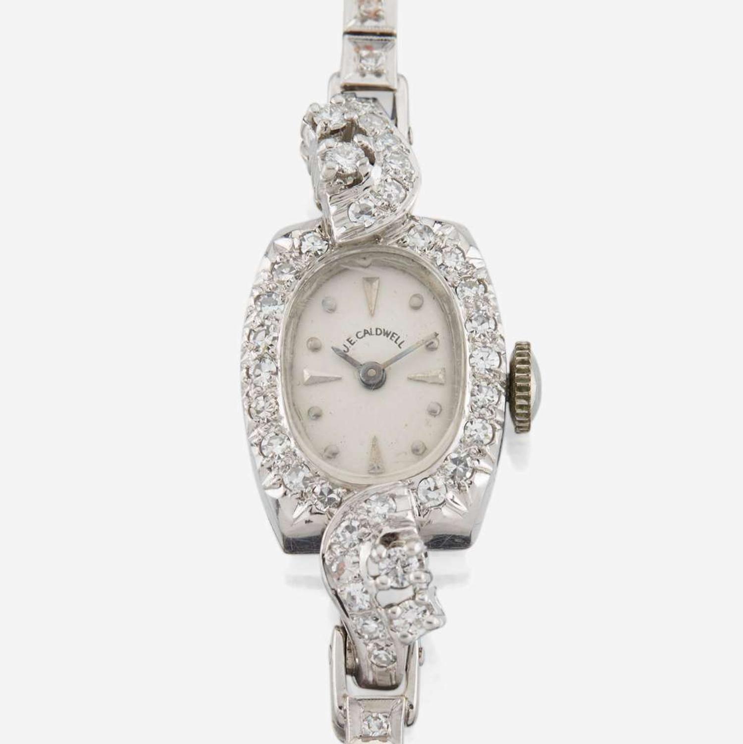 A lady's diamond and platinum bracelet watch, J.E Caldwell
