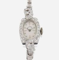 A lady's diamond and platinum bracelet watch, J.E Caldwell