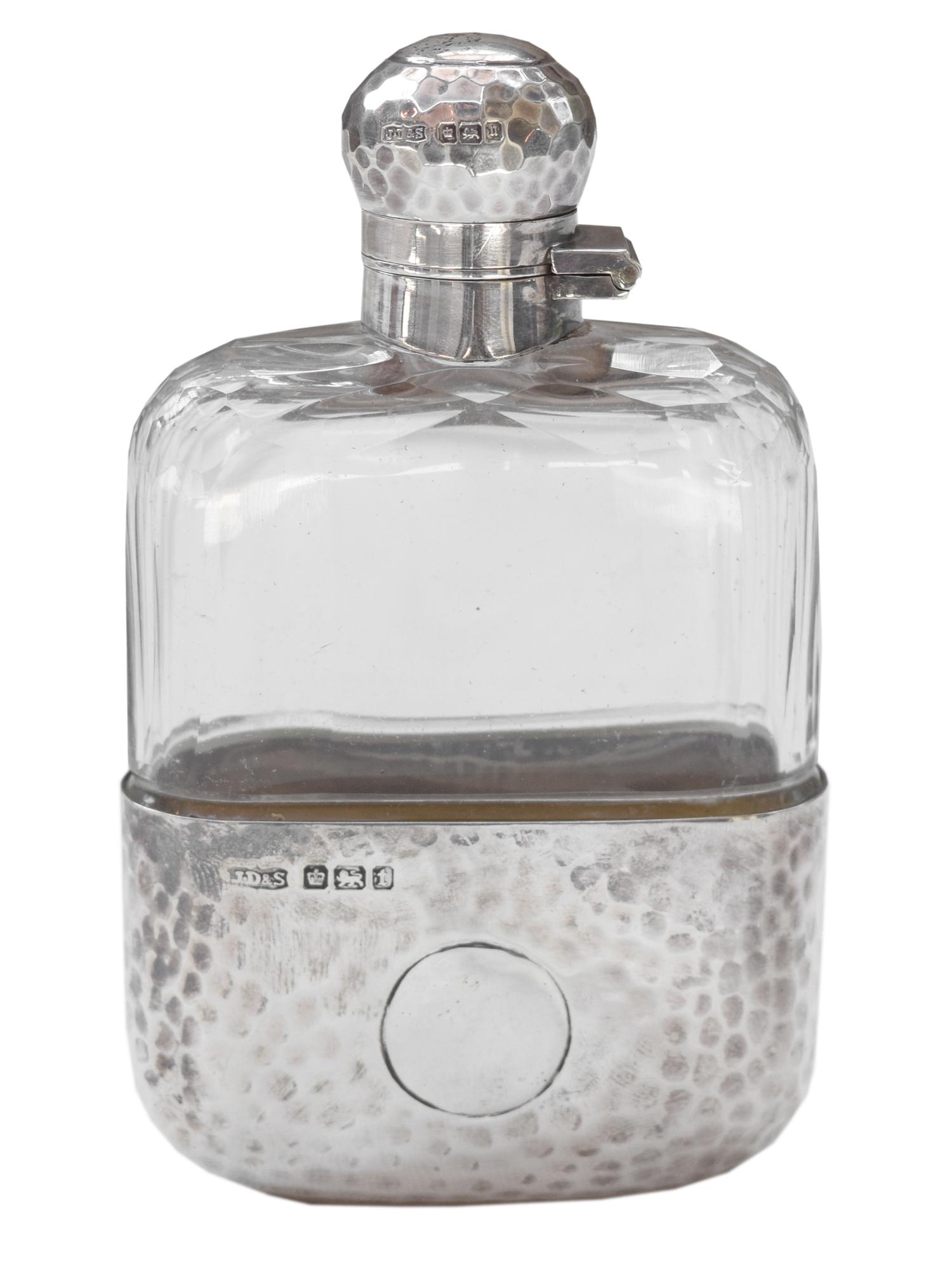 A James Dixon & Sons Hammered Silver and Glass Flask 2.5" W x 1" D x 4.5" H — England, Circa 1911
