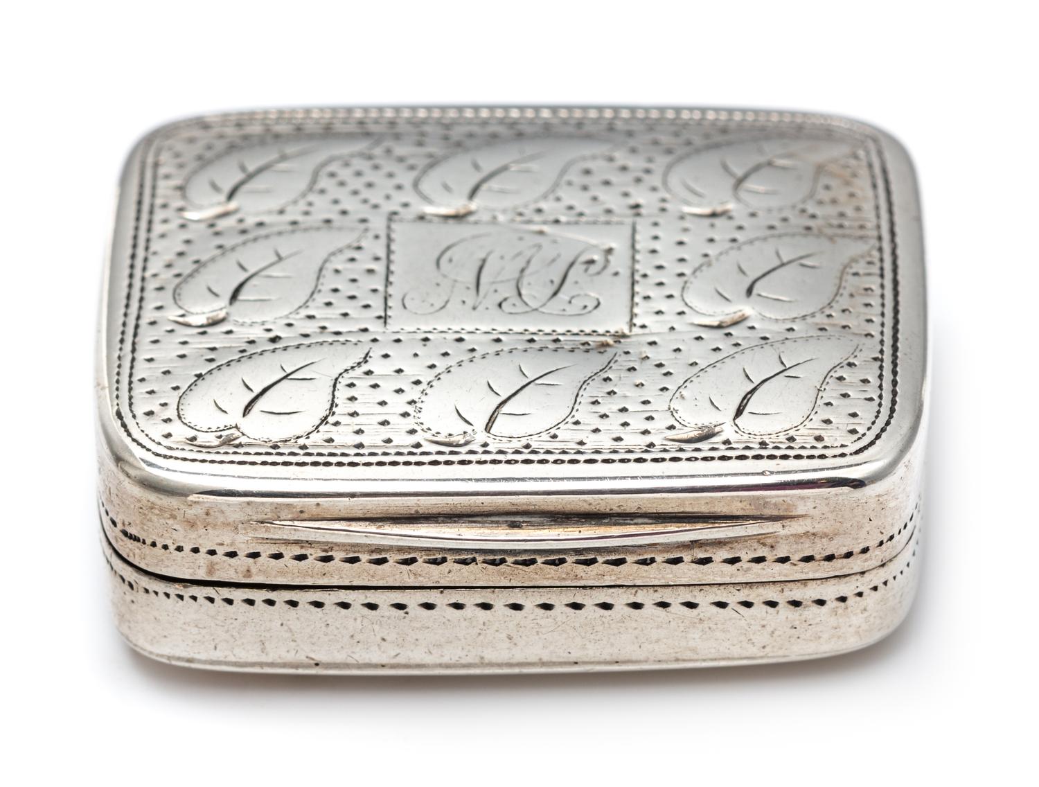 A George III Silver Vinaigrette, Matthew Linwood, Birmingham, 1810, the lid decorated with foliate and stippled decoration centered by