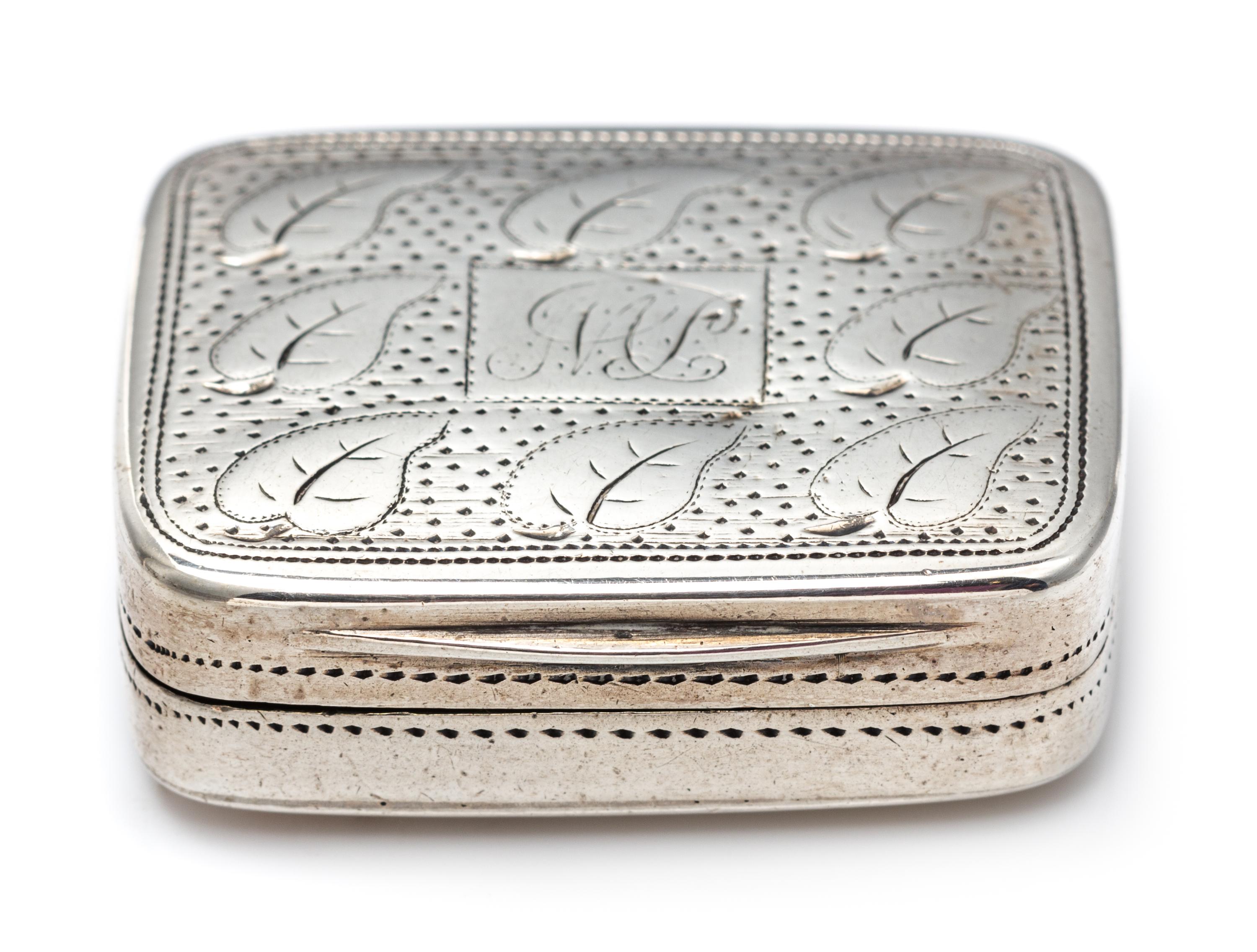 A George III Silver Vinaigrette, Matthew Linwood, Birmingham, 1810, the lid decorated with foliate and stippled decoration centered by