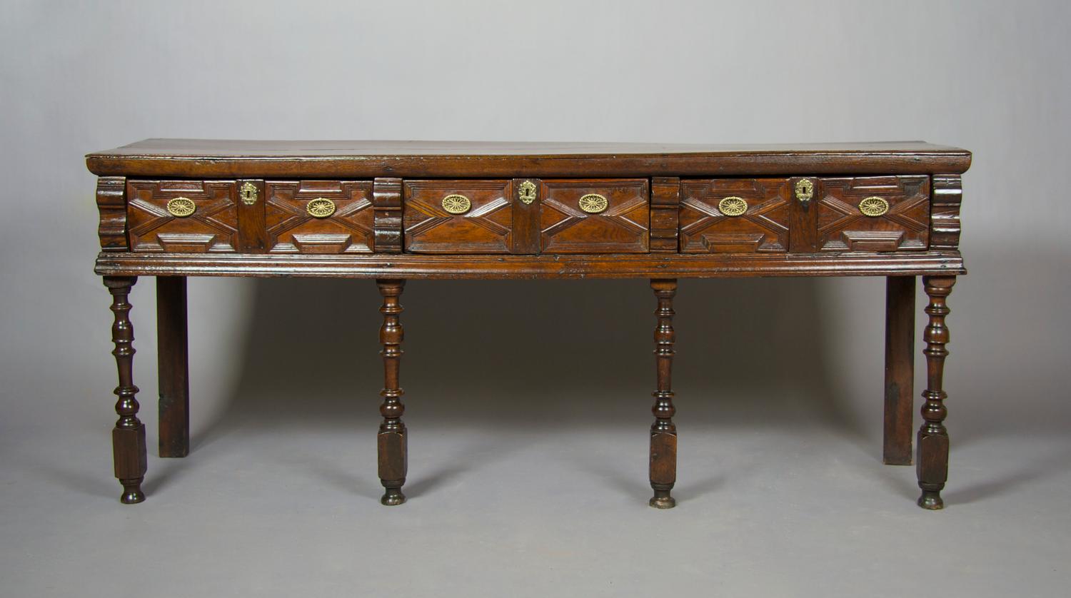 An English Charles II Style Sideboard, Height 34 1/2 x width 83 x depth 19 1/2 inches.