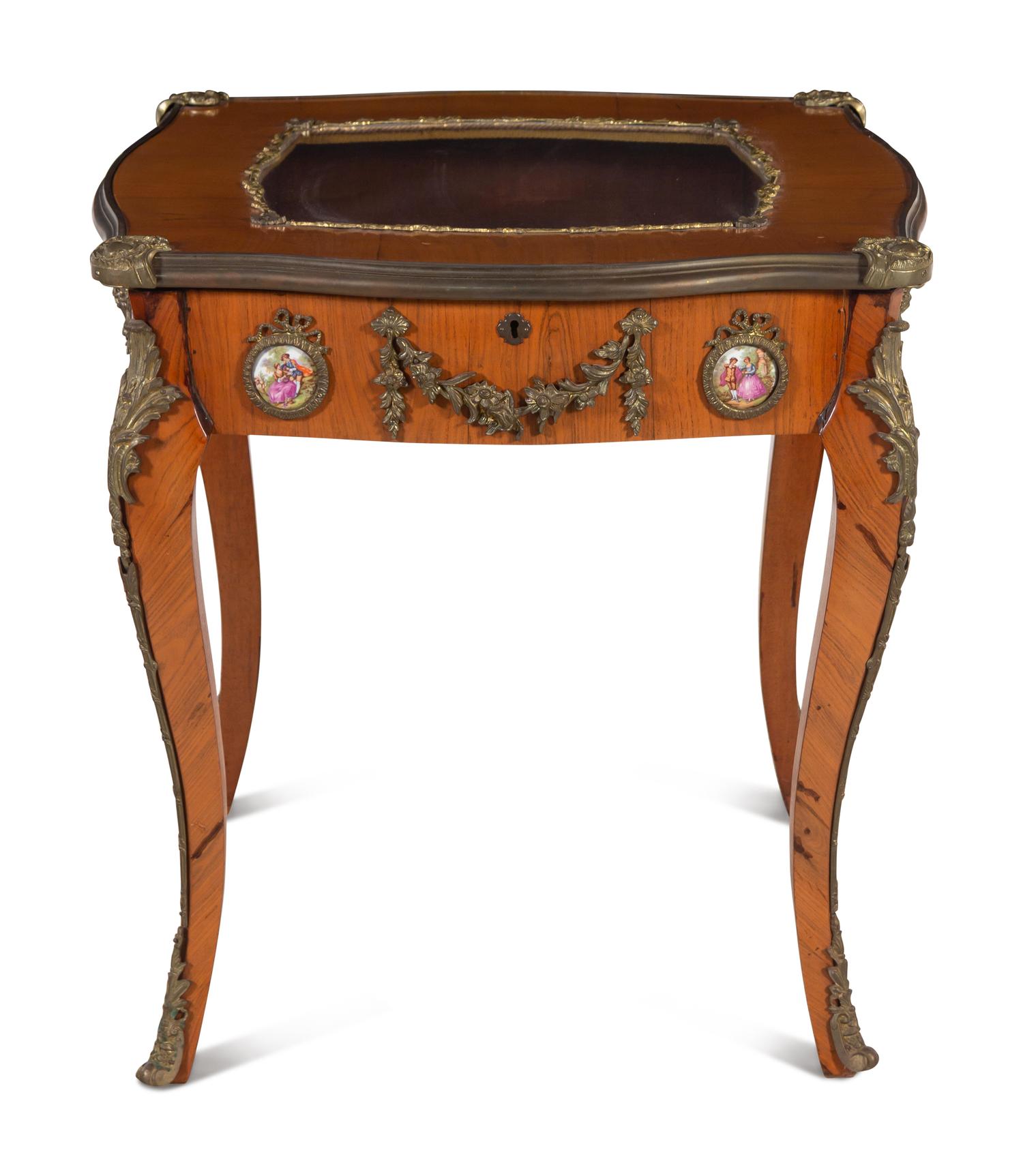 A Louis XV Style Gilt Metal and Porcelain Mounted Vitrine Table