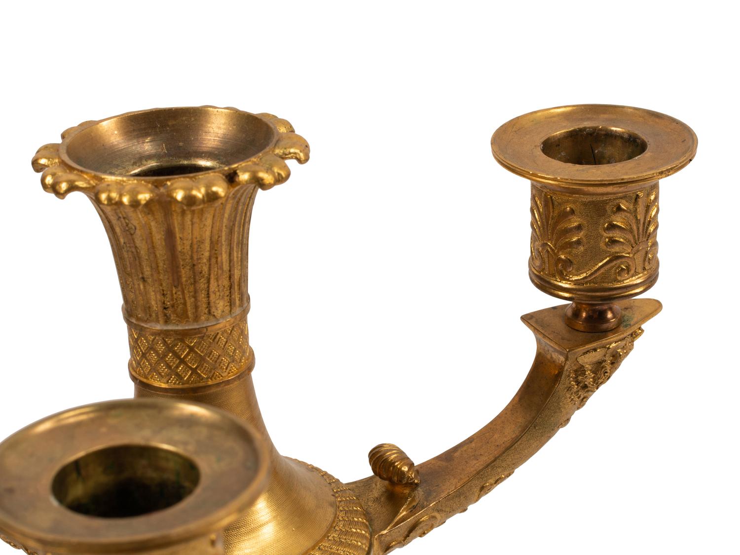 A Pair of Empire Style Gilt and Patinated Bronze Four-Light Candelabra