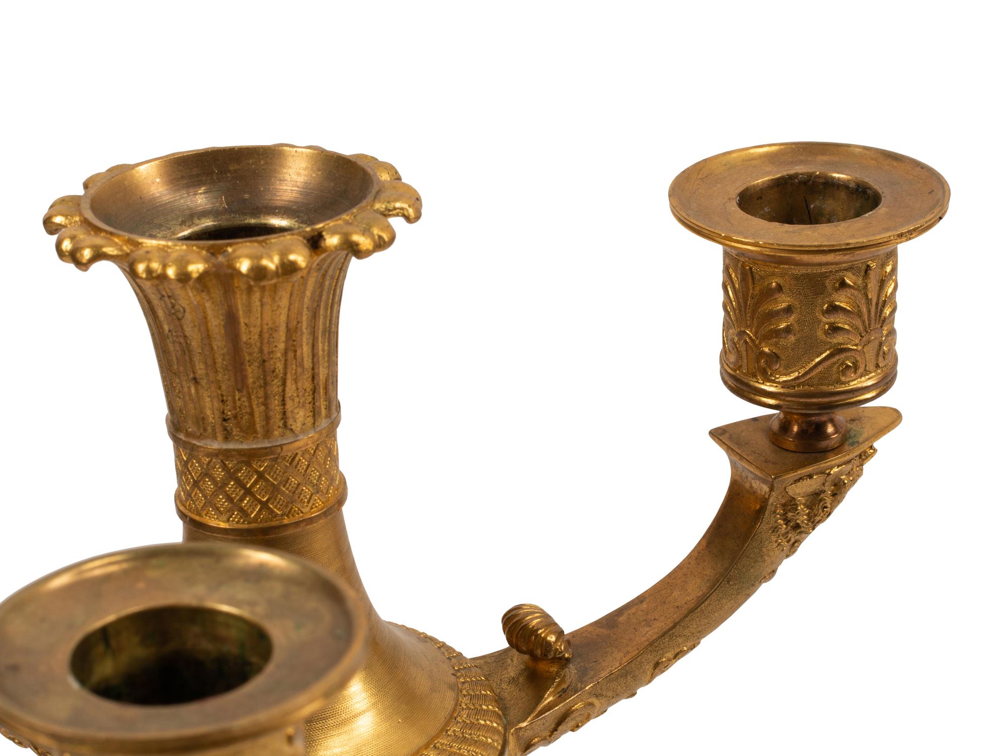 A Pair of Empire Style Gilt and Patinated Bronze Four-Light Candelabra