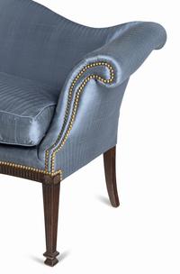 A George III Style Carved Mahogany Camelback Sofa