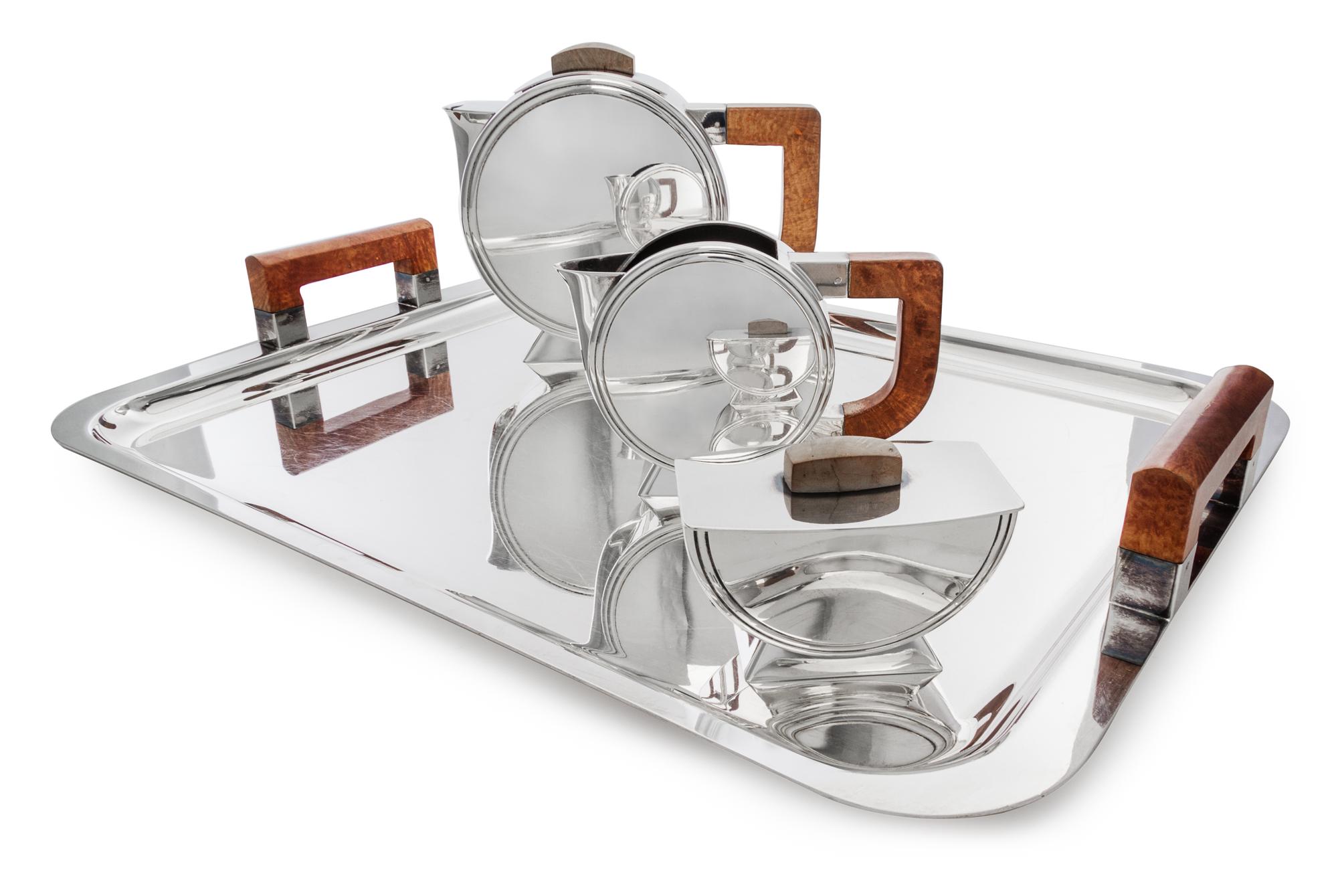 A French Art Deco Style Silver Plate Tea Service, Christofle after a design by Christian Fjerdingstad, Paris, comprising a tea pot, a c