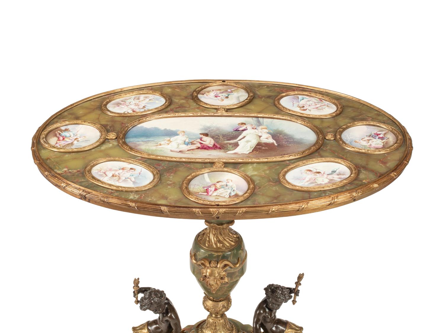 A Napoleon III Gilt Bronze Mounted Onyx and Porcelain Plaque-Inset Table