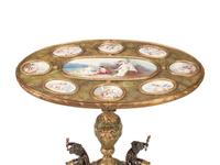 A Napoleon III Gilt Bronze Mounted Onyx and Porcelain Plaque-Inset Table