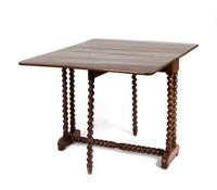 A Jacobean Style Mahogany Drop Leaf Trestle Table — 20TH CENTURY