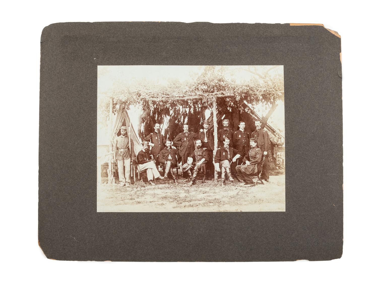 [CIVIL WAR]. A group of 2 photographs with Civil War subject matter, incl. General Ferrero with officers of the IX Corps at Petersburg and Union troops occupying a Confederate redoubt on the North Anna River.