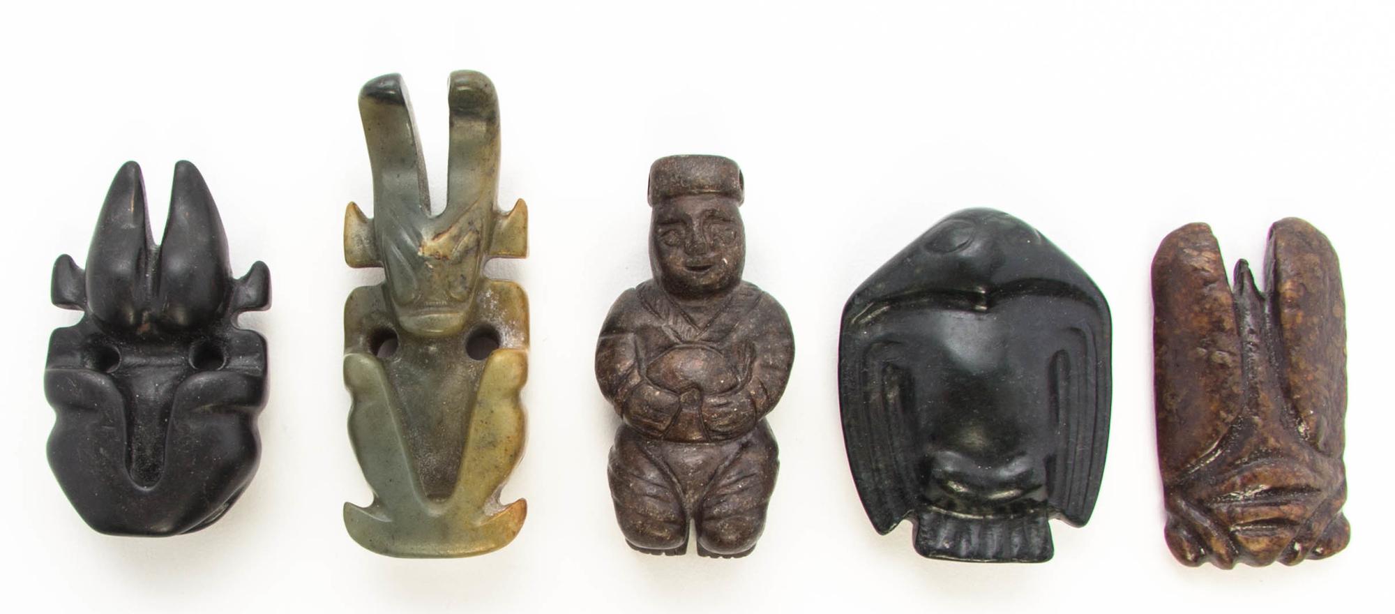 A Group of Five Carved Hardstone Toggles Height of tallest 3 1/8 inches.