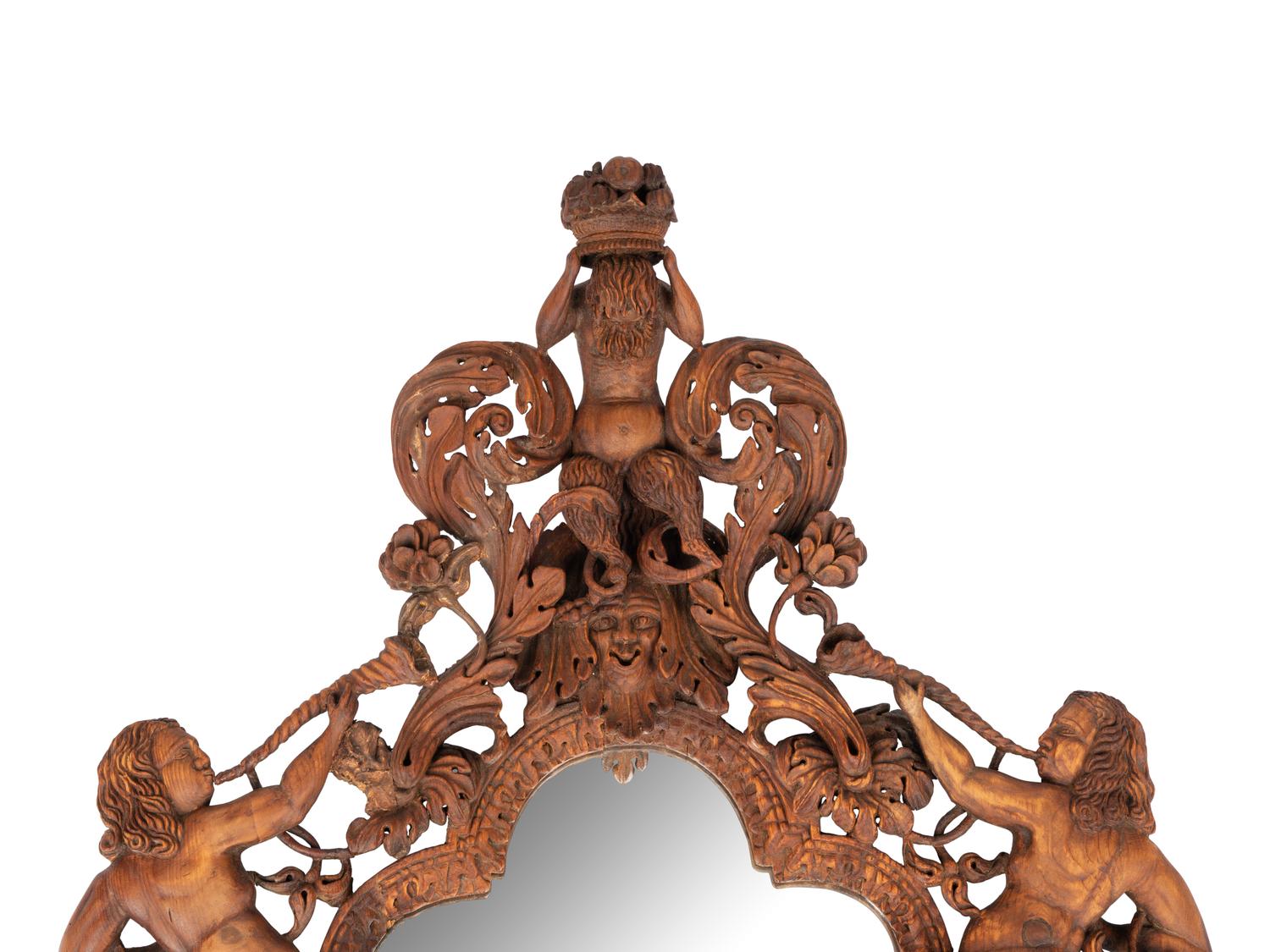 An Italian Carved Walnut Mirror in the Manner of Valentino Besarel