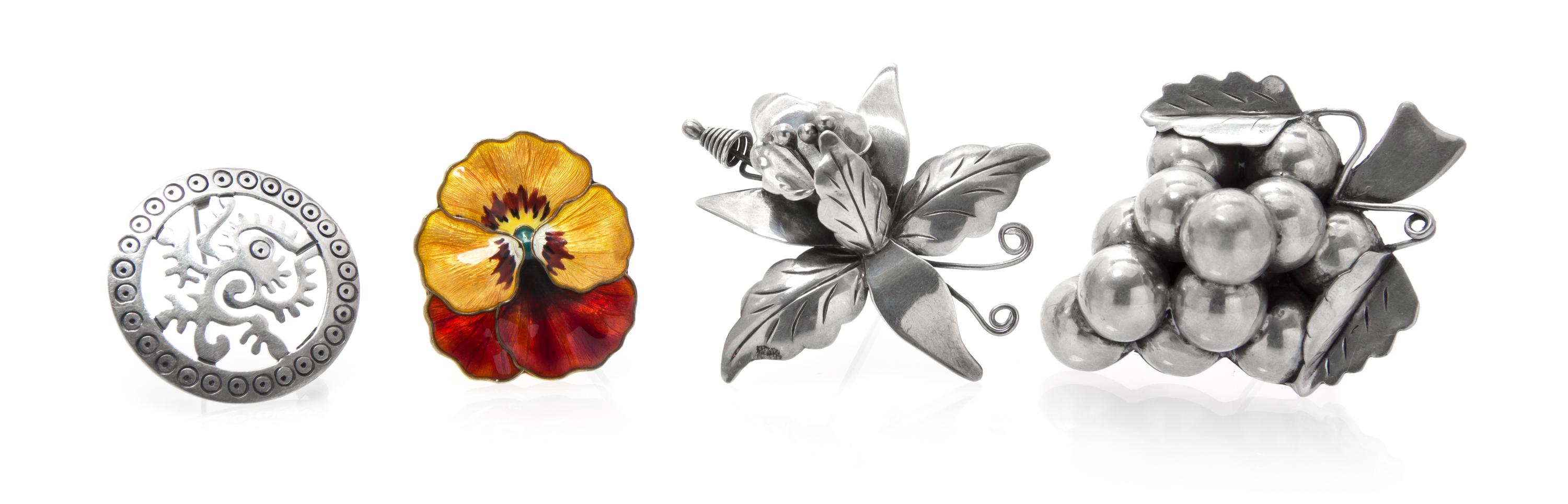 A Collection of Sterling Silver Brooches, 28.10 dwts.