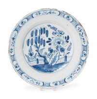 A Dutch Blue and White Glazed Delftware Charger