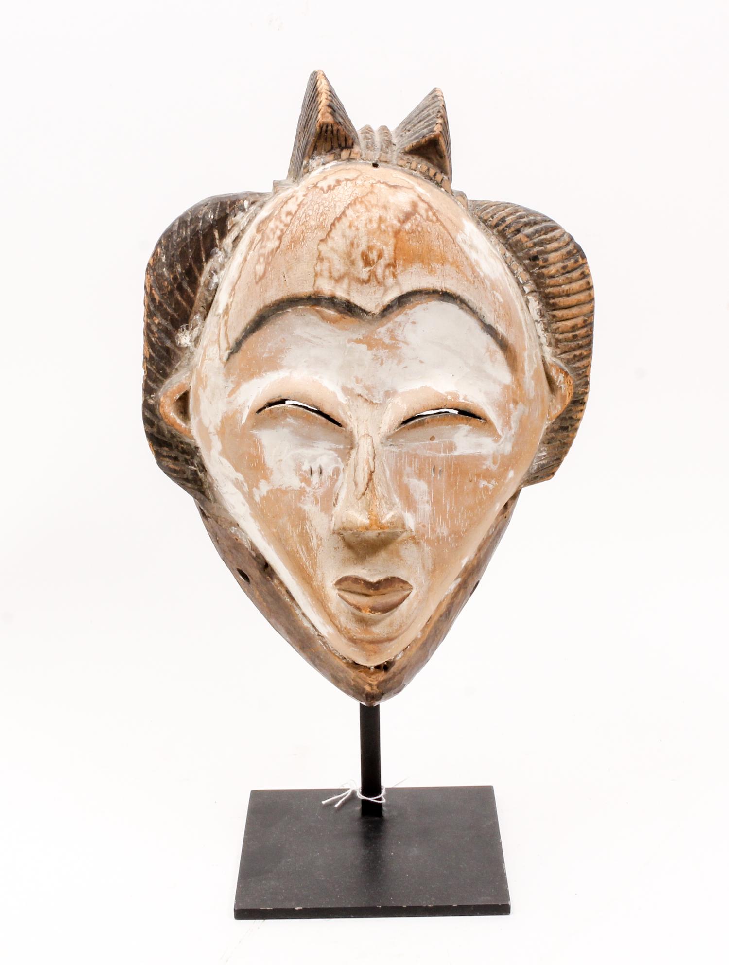 A White Face Mask, Punu (Gabon) Height overall 16 inches. — LATE 19TH CENTURY