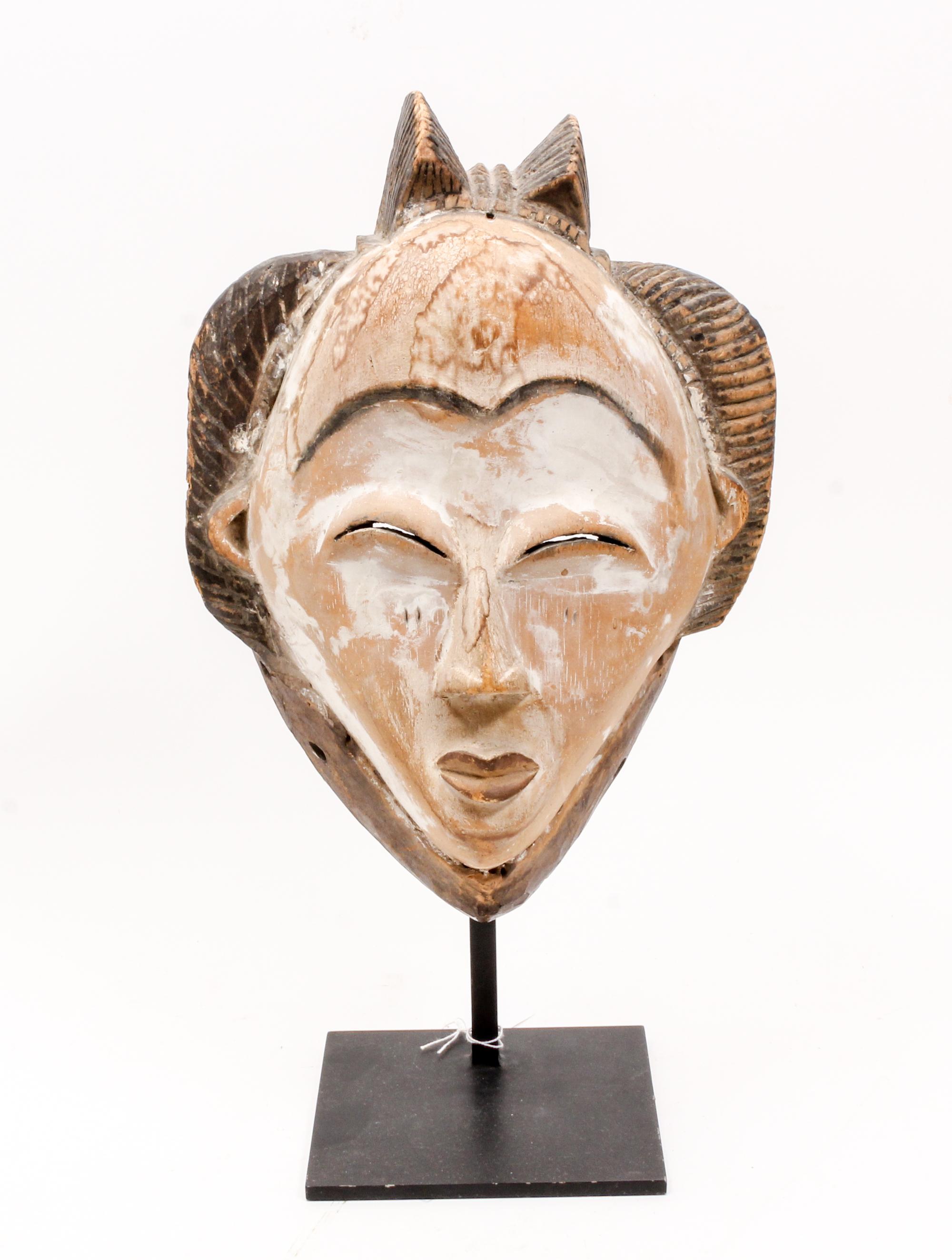 A White Face Mask, Punu (Gabon) Height overall 16 inches. — LATE 19TH CENTURY