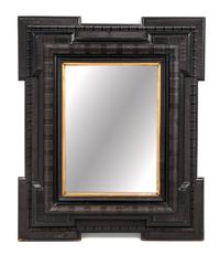 A Flemish or Spanish Ebonized Ribbon Cut Mirror Height 30 3/4 x width 25 1/2 inches. — 19TH CENTURY