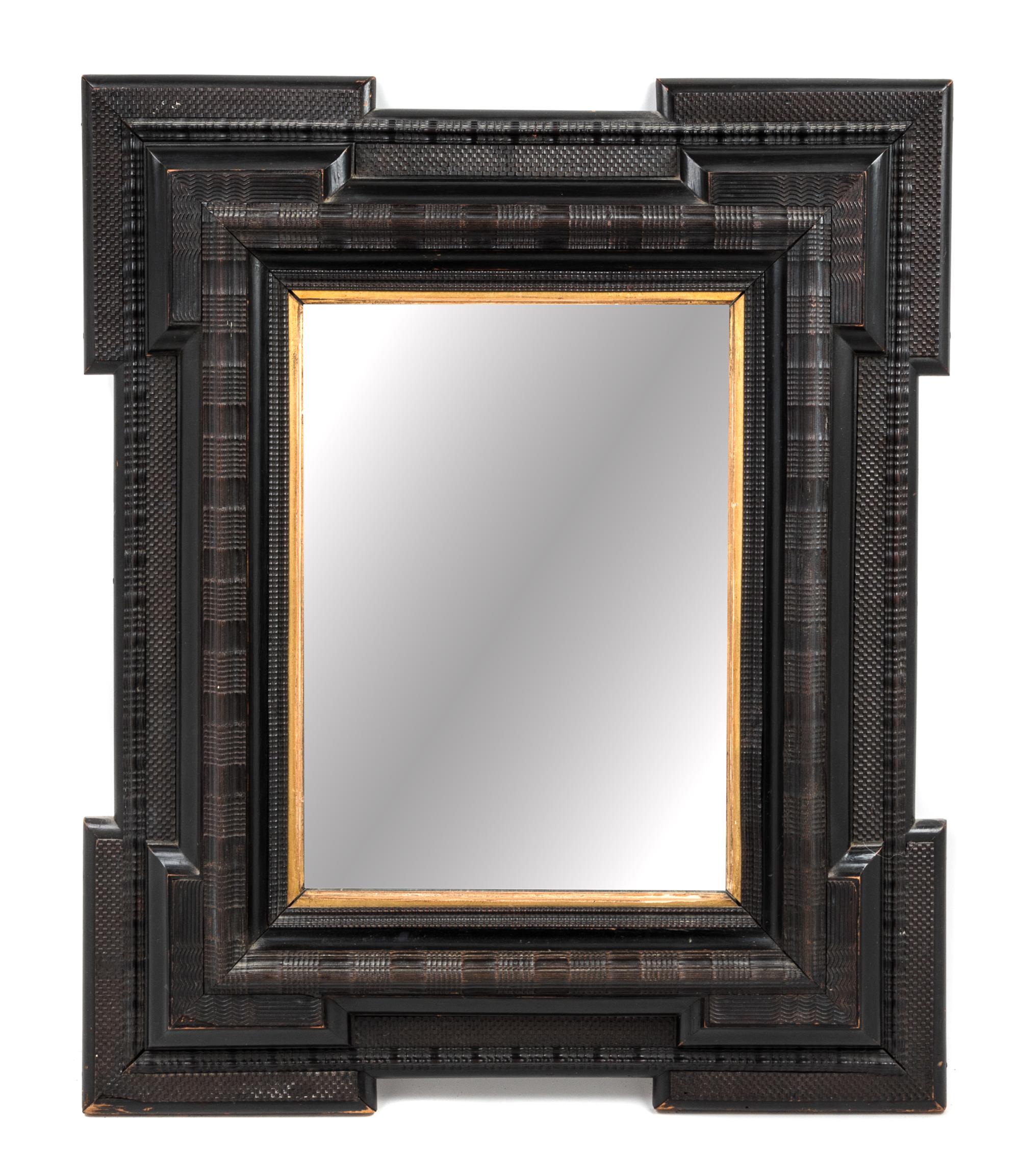 A Flemish or Spanish Ebonized Ribbon Cut Mirror Height 30 3/4 x width 25 1/2 inches. — 19TH CENTURY