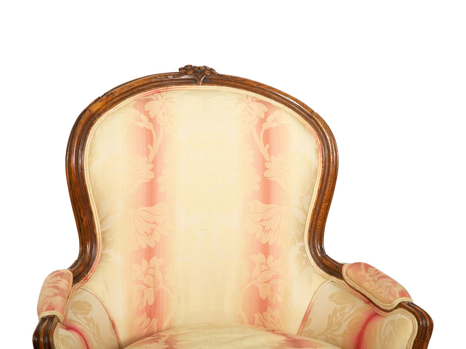A Pair of Louis XV Style Walnut Bergères