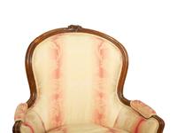 A Pair of Louis XV Style Walnut Bergères