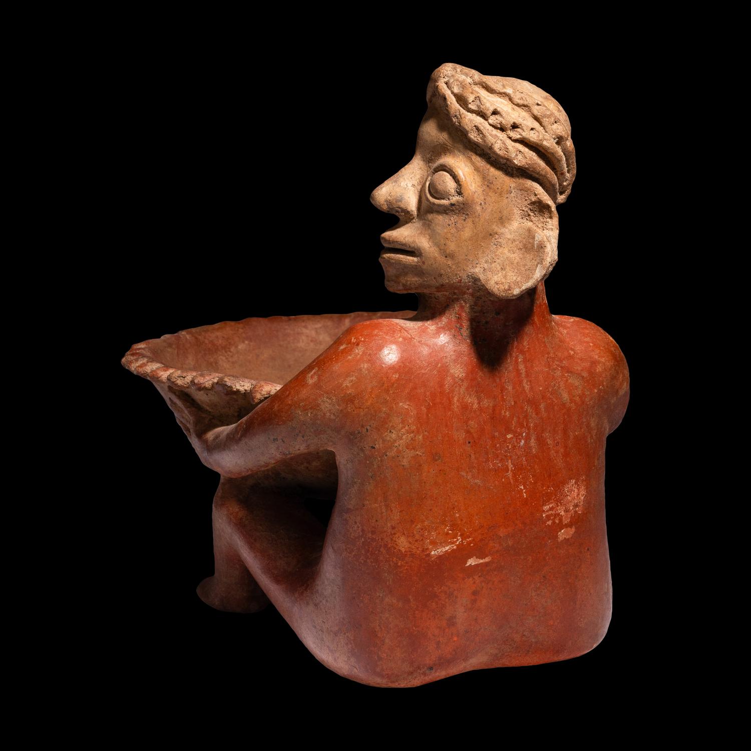A Jalisco Seated Figure with Offering Bowl