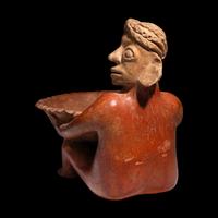 A Jalisco Seated Figure with Offering Bowl