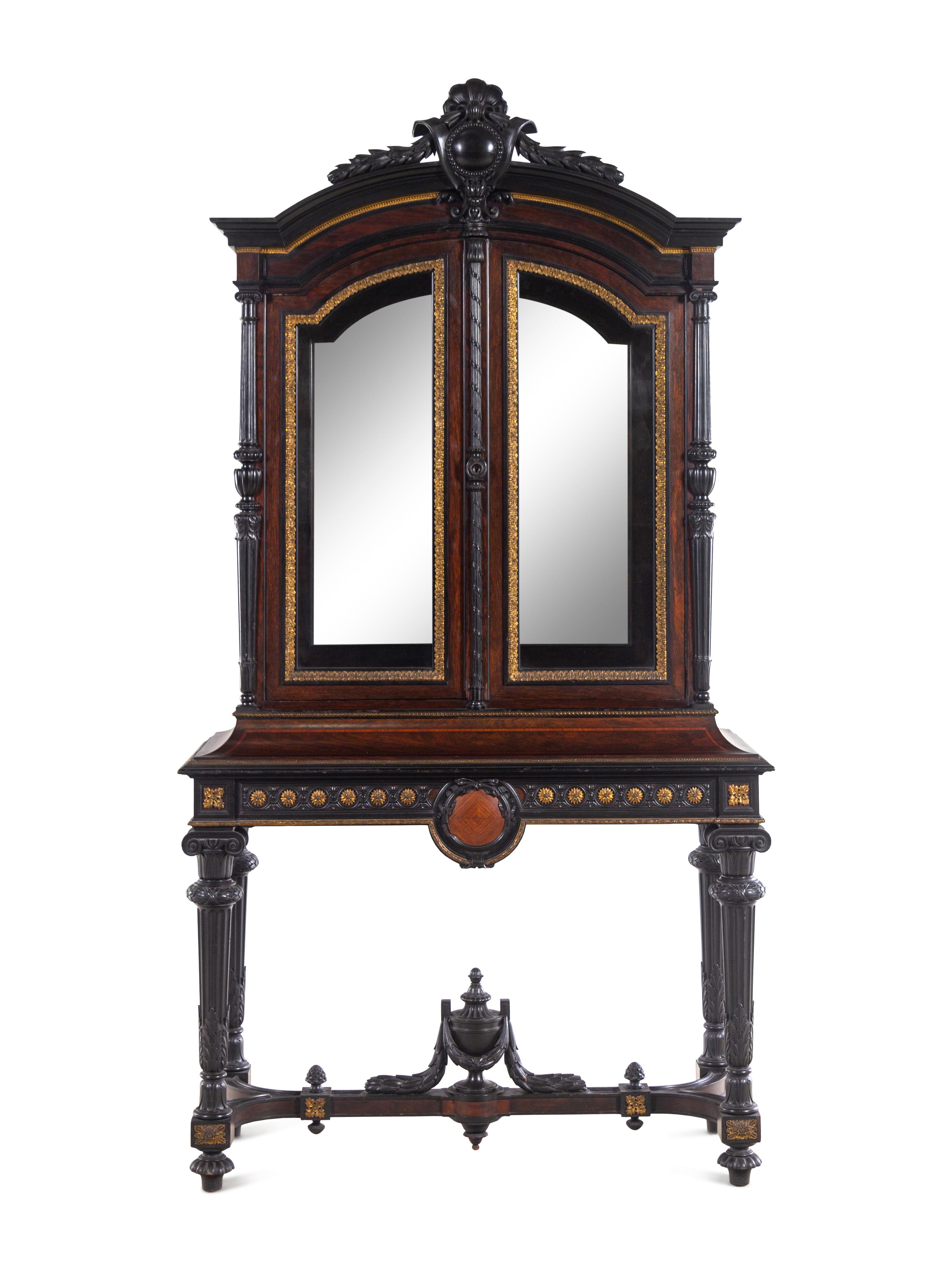 A Renaissance Revival Carved Walnut, Parcel Ebonized and Parcel Gilt Vitrine Cabinet on Stand