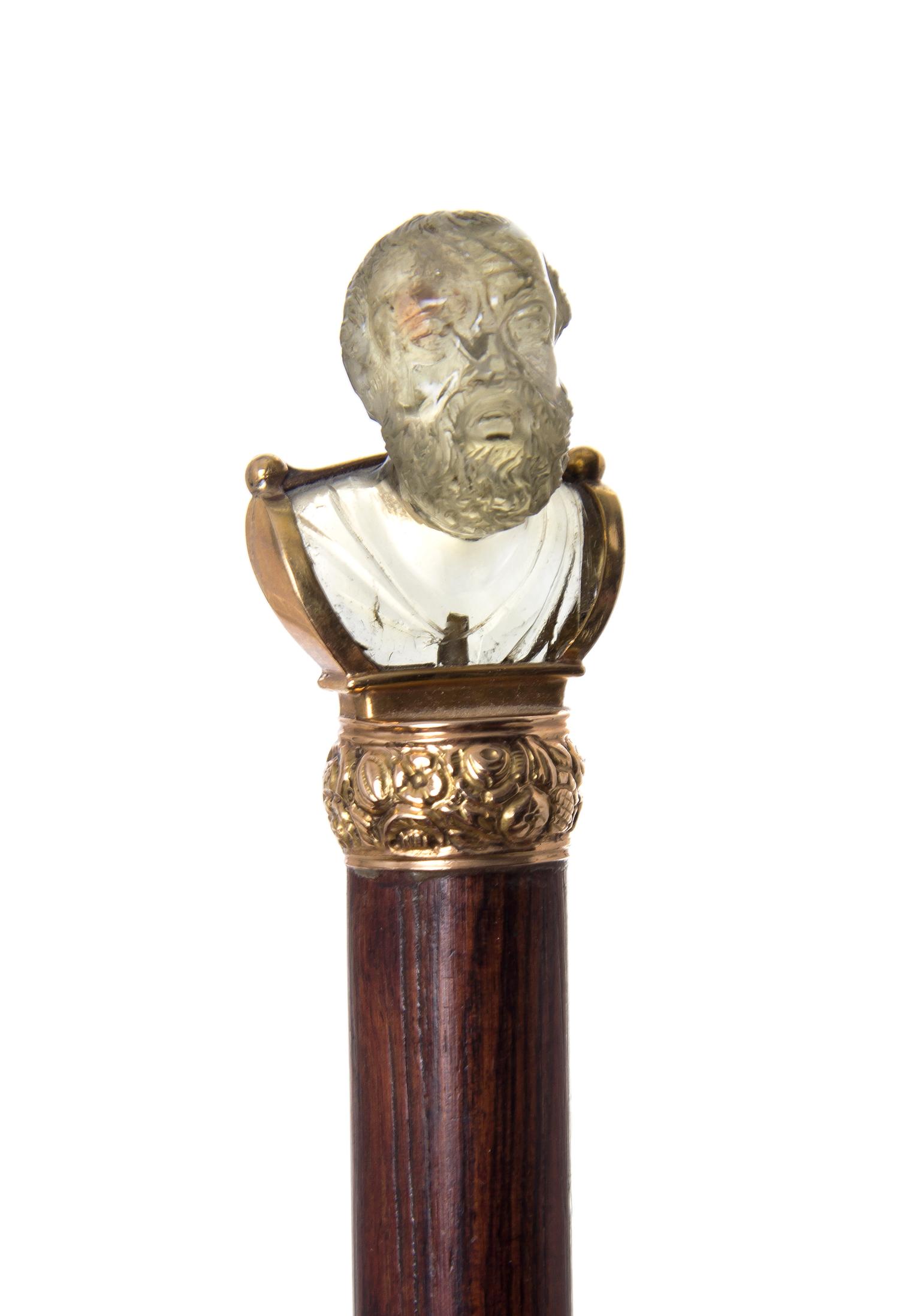 A Continental Carved Quartz Walking Stick, Length of handle 1 1/2 x length overall 35 1/2 inches.
