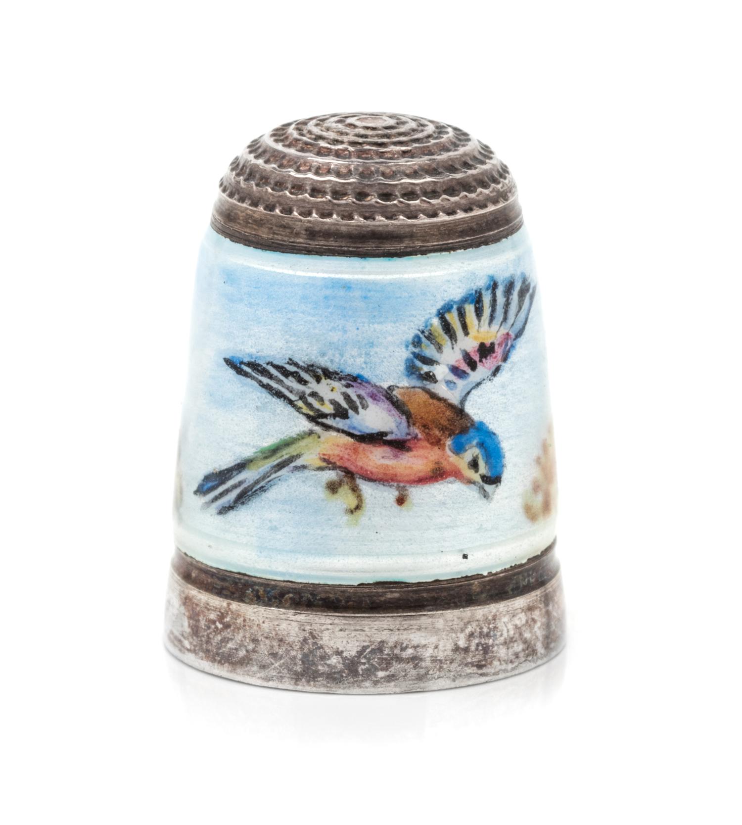 An English Silver and Enamel Thimble, Joseph Swan & Sons, Birmingham, 1972, the knurled top above a polychrome enamel band depicting a