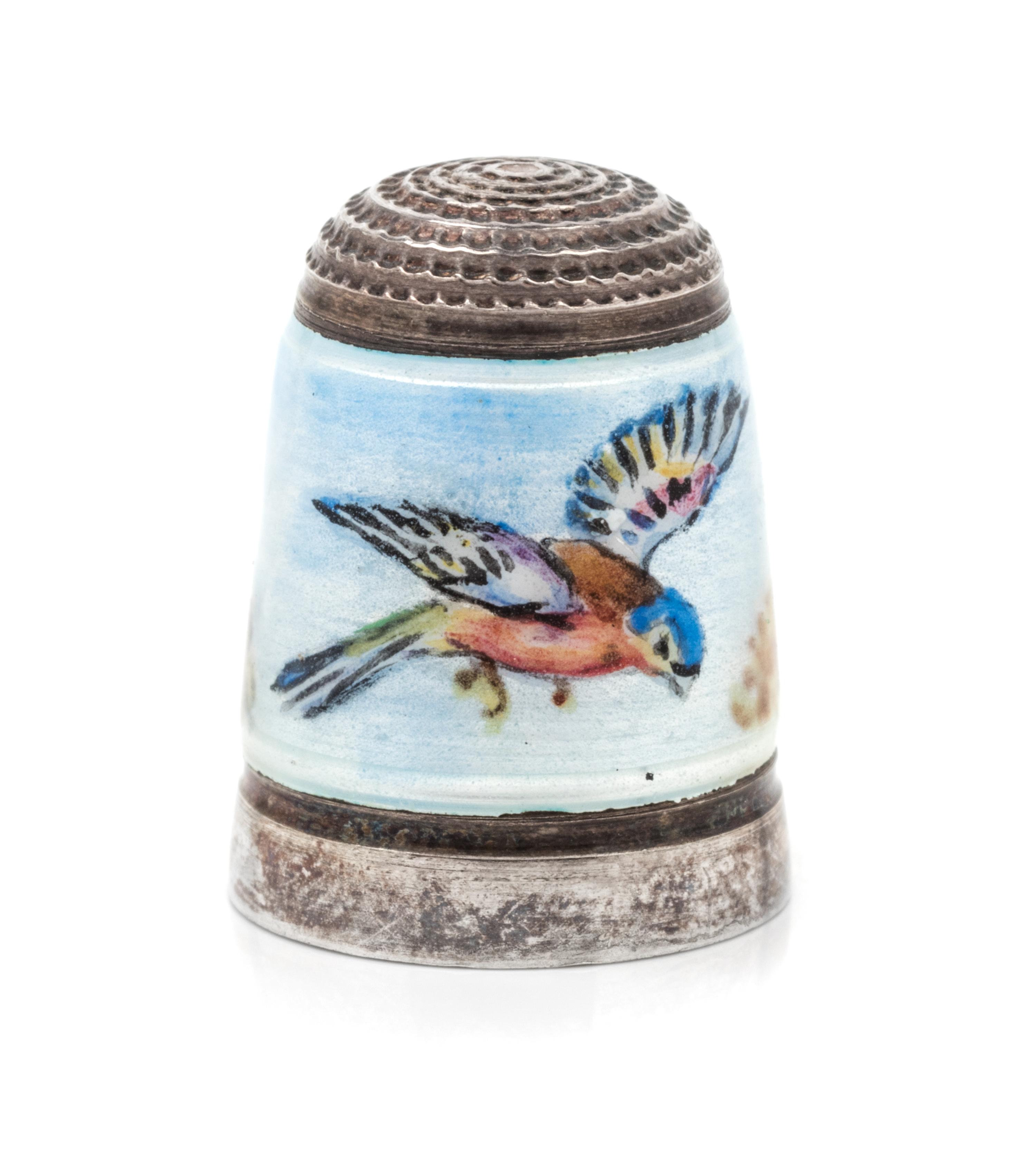 An English Silver and Enamel Thimble, Joseph Swan & Sons, Birmingham, 1972, the knurled top above a polychrome enamel band depicting a