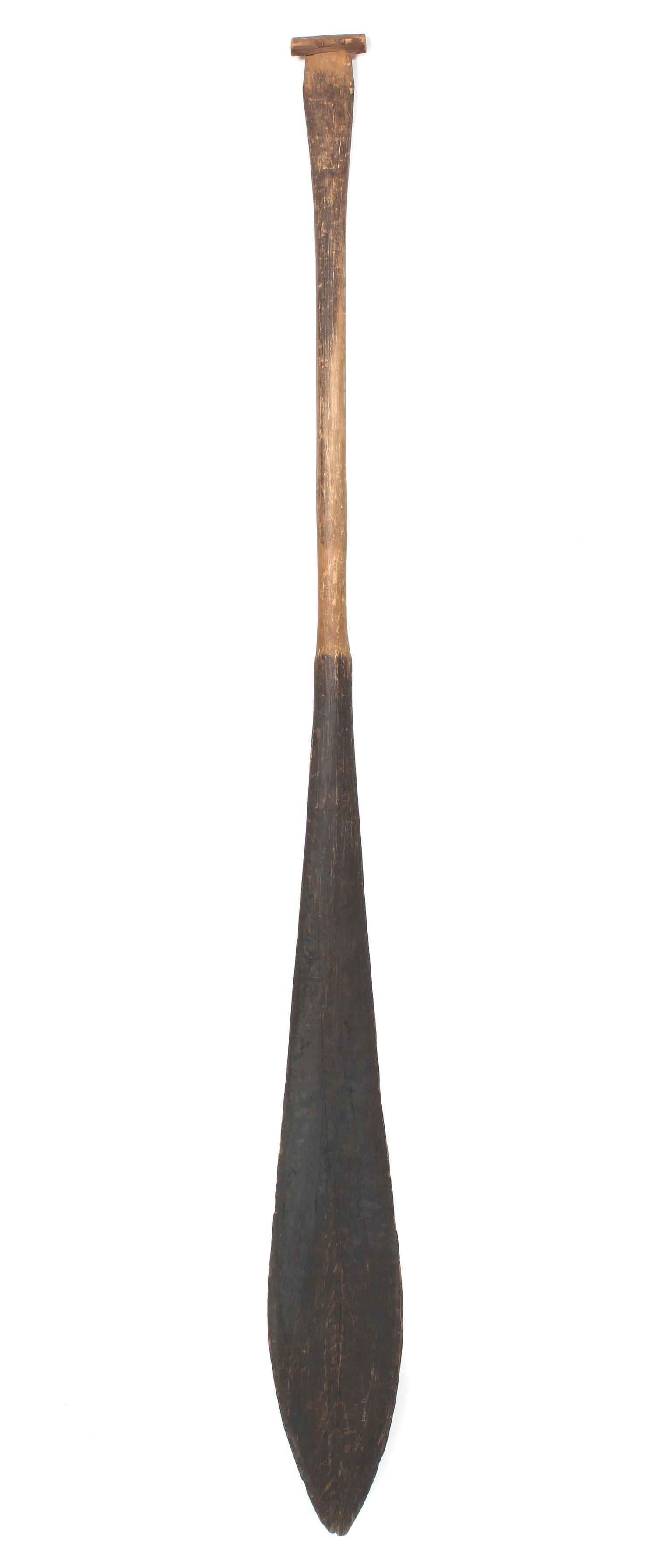 A Nuu-Chah-Nulth Wood Paddle Length 56 1/4 inches.