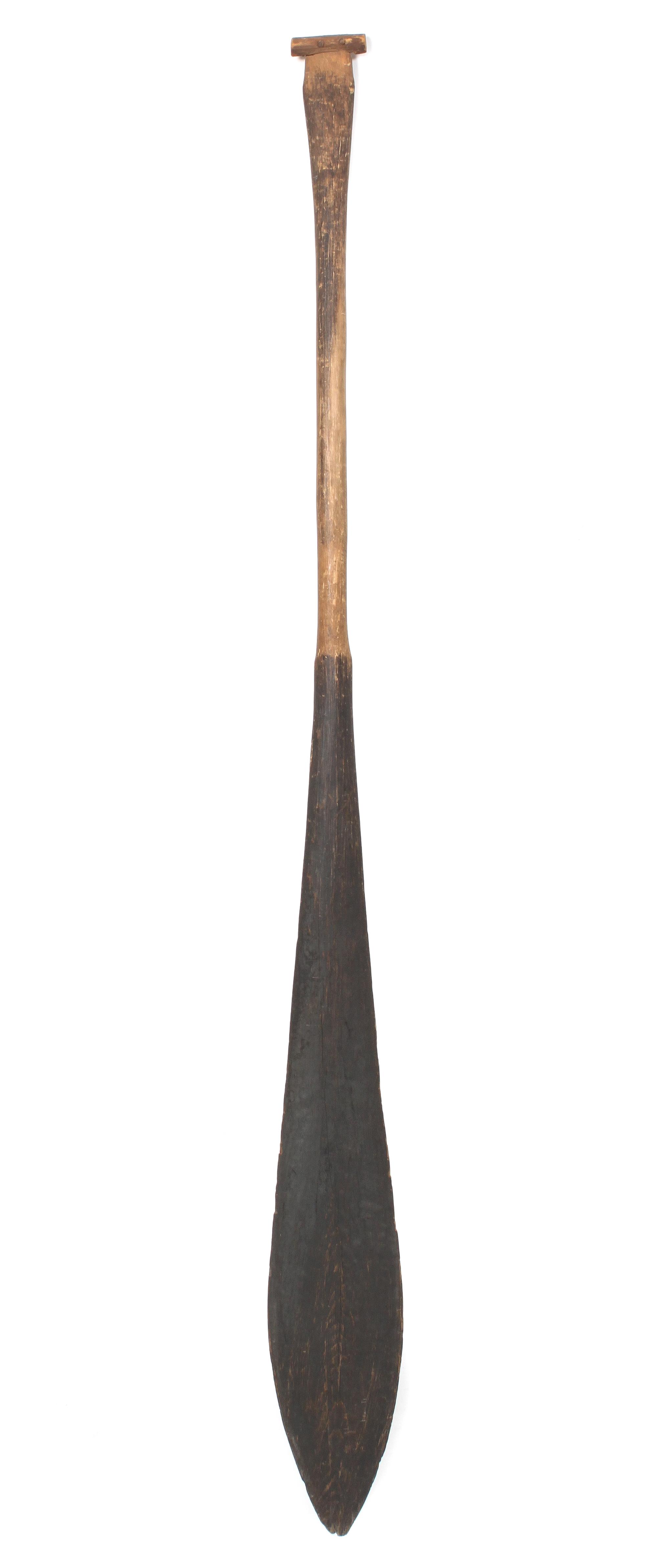 A Nuu-Chah-Nulth Wood Paddle Length 56 1/4 inches.