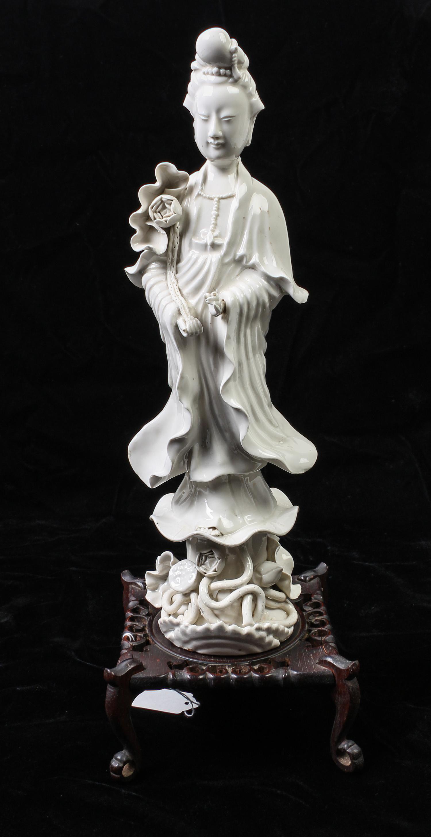 A Chinese Blanc de Chine Porcelain Figure of Guanyin Height of figure 14 inches. — MID-LATE 20TH CENTURY