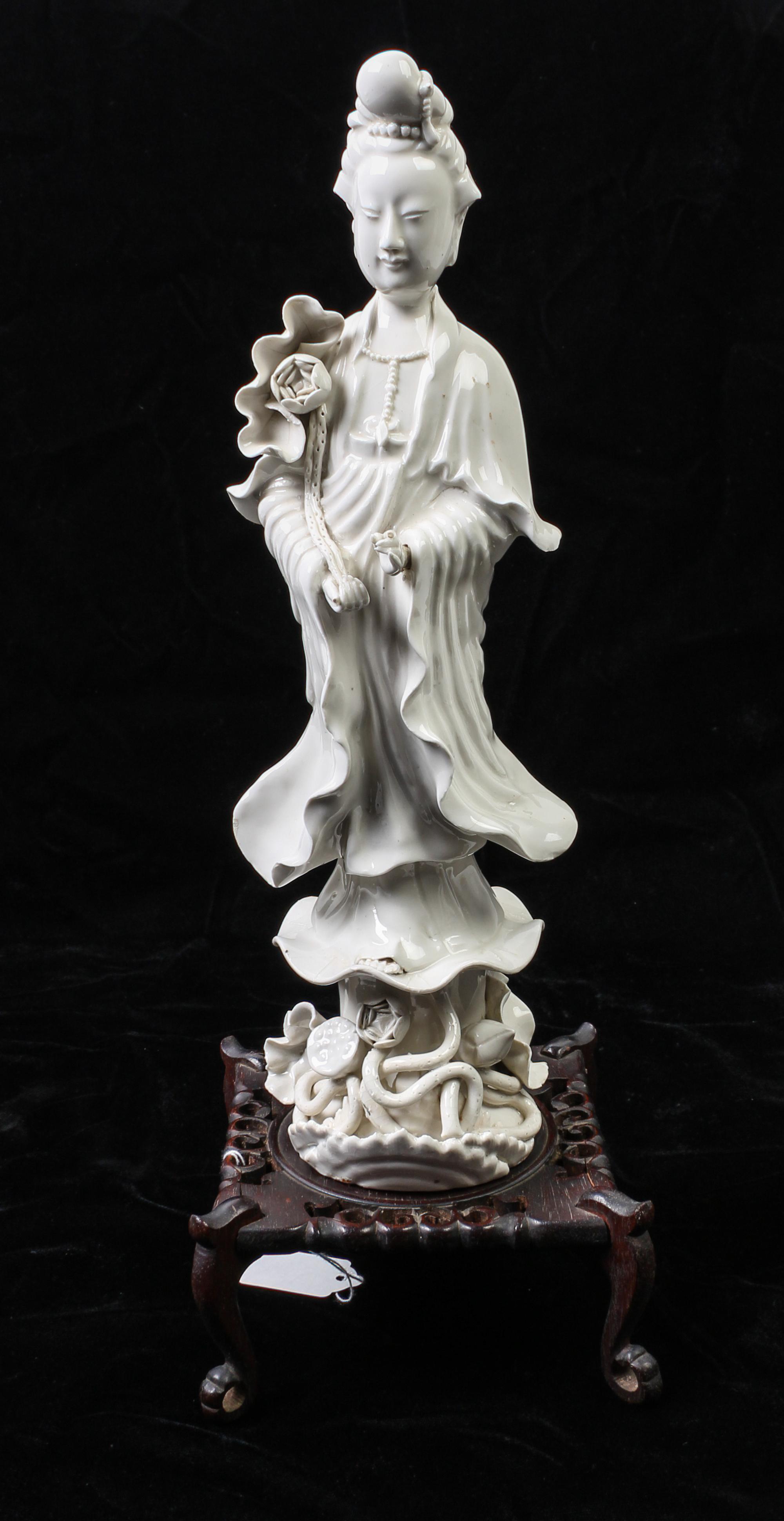 A Chinese Blanc de Chine Porcelain Figure of Guanyin Height of figure 14 inches. — MID-LATE 20TH CENTURY