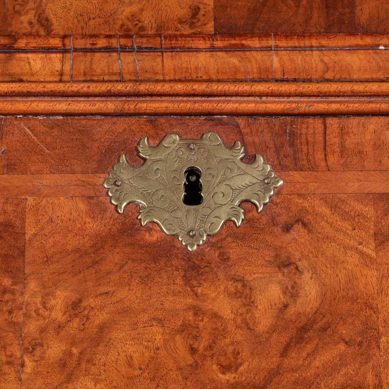 A Queen Anne inlaid and veneered walnut double-dome bureau bookcase circa 1720