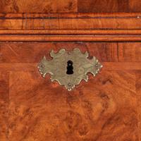 A Queen Anne inlaid and veneered walnut double-dome bureau bookcase circa 1720